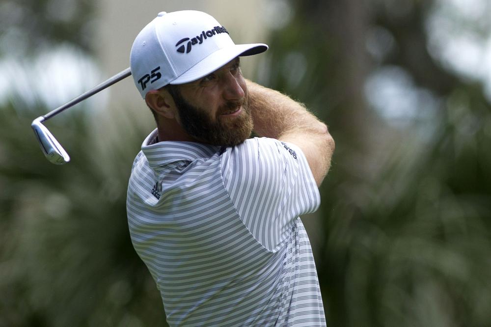 Dustin Johnson tees off from the eighth hole during the third round of the RBC Heritage Golf Tournament at Harbour Town Golf Links in Hilton Head, South Carolina, Saturday. — Reuters 