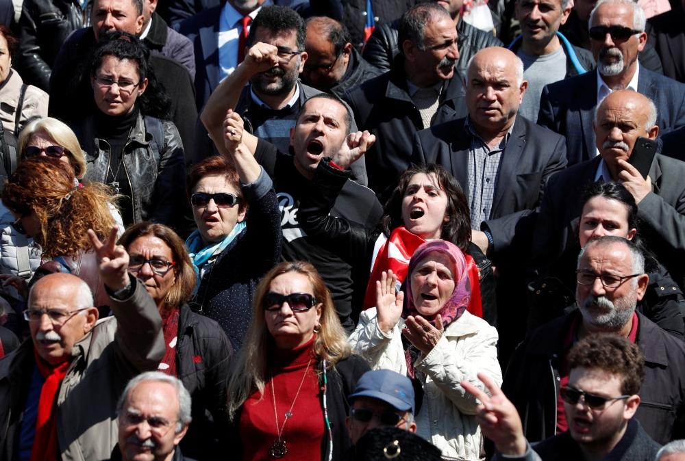 


Supporters of the main opposition Republican People’s Party (CHP) shout anti-government slogans during a protest against the attack on their leader Kemal Kilicdaroglu, in Istanbul, Monday. — Reuters