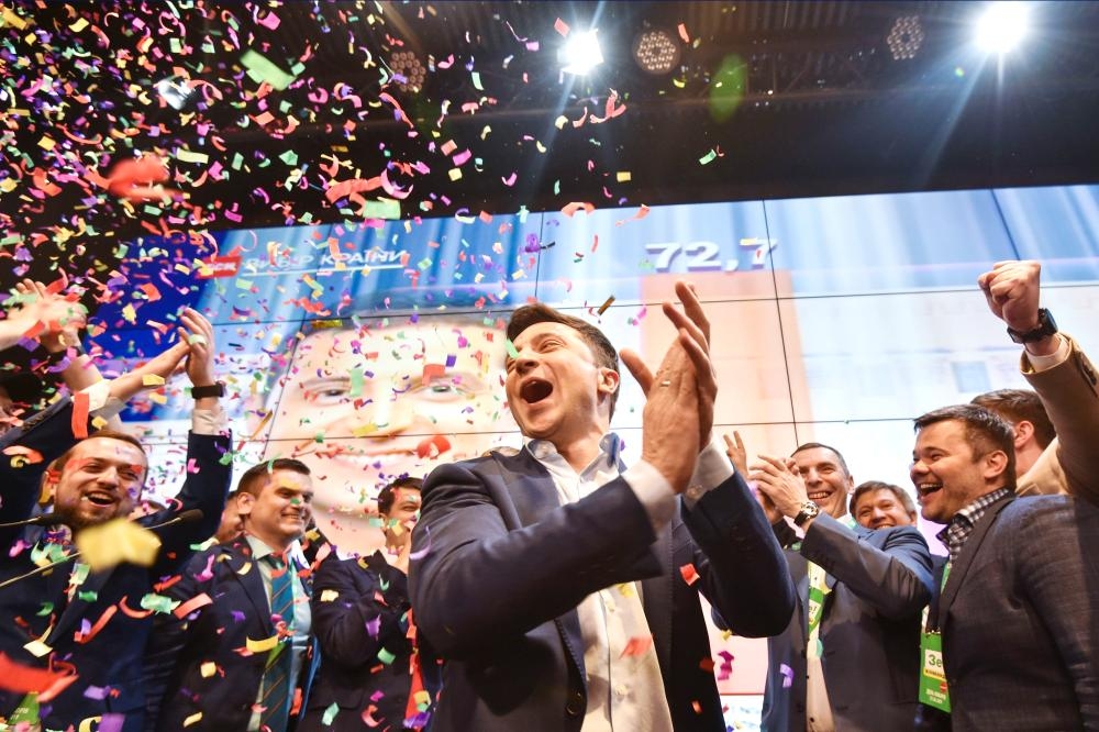


Ukrainian comedian and presidential candidate Volodymyr Zelensky reacts after the announcement of the first exit poll results in the second round of Ukraine’s presidential election at his campaign headquarters in Kiev on Sunday. — AFP