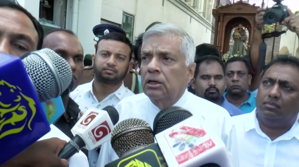 Sri Lanka’s Prime Minister Ranil Wickremesinghe speaks to media at St. Anthony’s Shrine in Colombo on Sunday. — Reuters