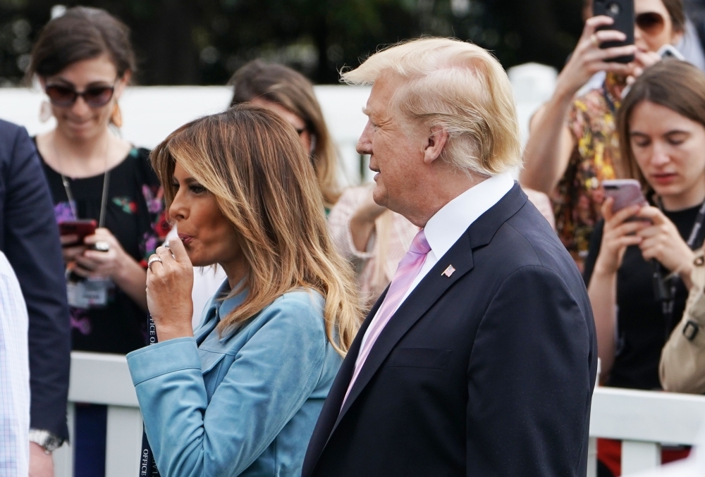 US First Lady Melania Trump blows a whistle to start a race during the annual White House Easter Egg Roll as US President Donald Trump watches on the South Lawn of the White House in Washington on Monday. — AFP