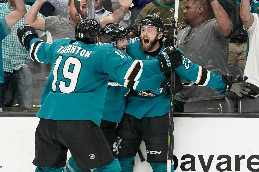 San Jose Sharks’ right wing Barclay Goodrow (R) celebrates with defenseman Marc-Edouard Vlasic (C) and center Joe Thornton after defeating the Vegas Golden Knights in Game 7 of the first round of the 2019 Stanley Cup Playoffs at SAP Center at San Jose Tuesday. — Reuters