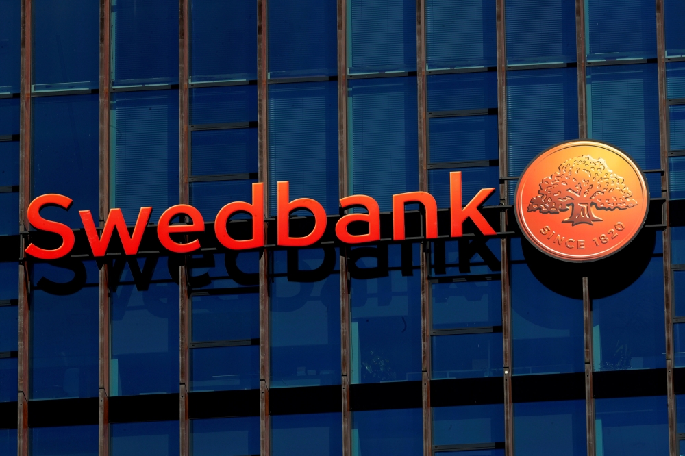 Swedbank sign is seen on the building of the bank's Lithuanian headquarters in Vilnius, Lithuania, in this file photo. — Reuters