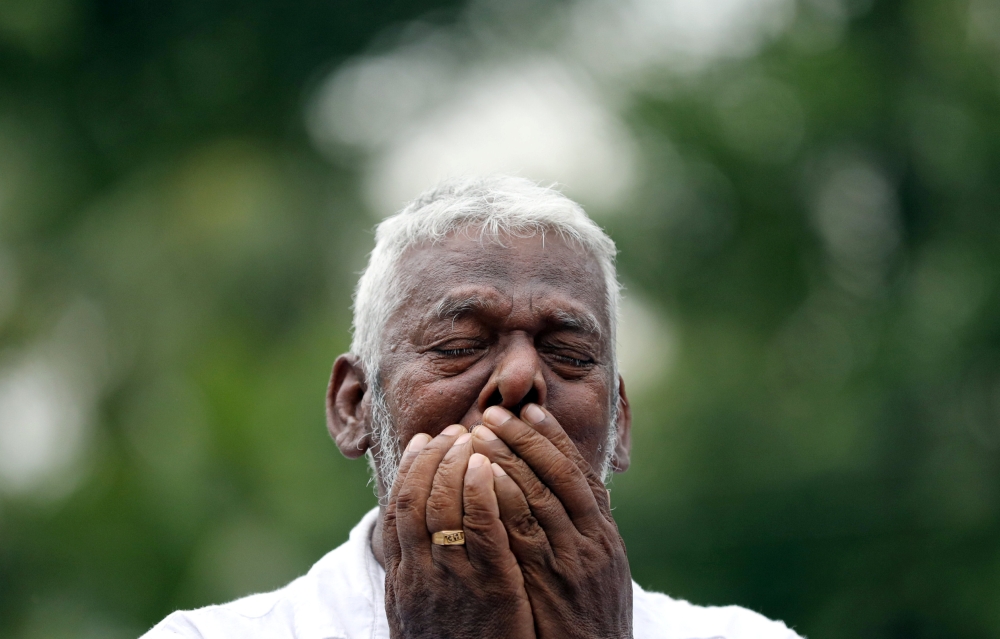 A man mourns at the funeral of Dhami Brindya, 13, victim of a string of suicide bomb attacks on churches and luxury hotels on Easter Sunday, in Negombo, Sri Lanka, on Thursday. — Reuters