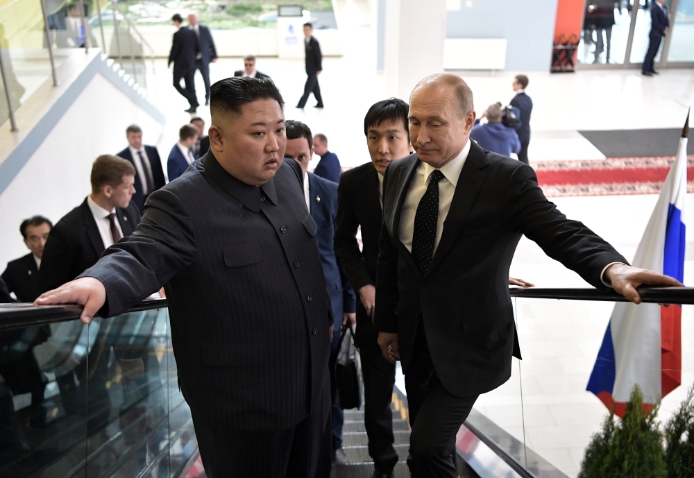 Russian President Vladimir Putin meets with North Korean leader Kim Jong Un at the Far Eastern Federal University campus on Russky island in the far-eastern Russian port of Vladivostok on Thursday. — AFP