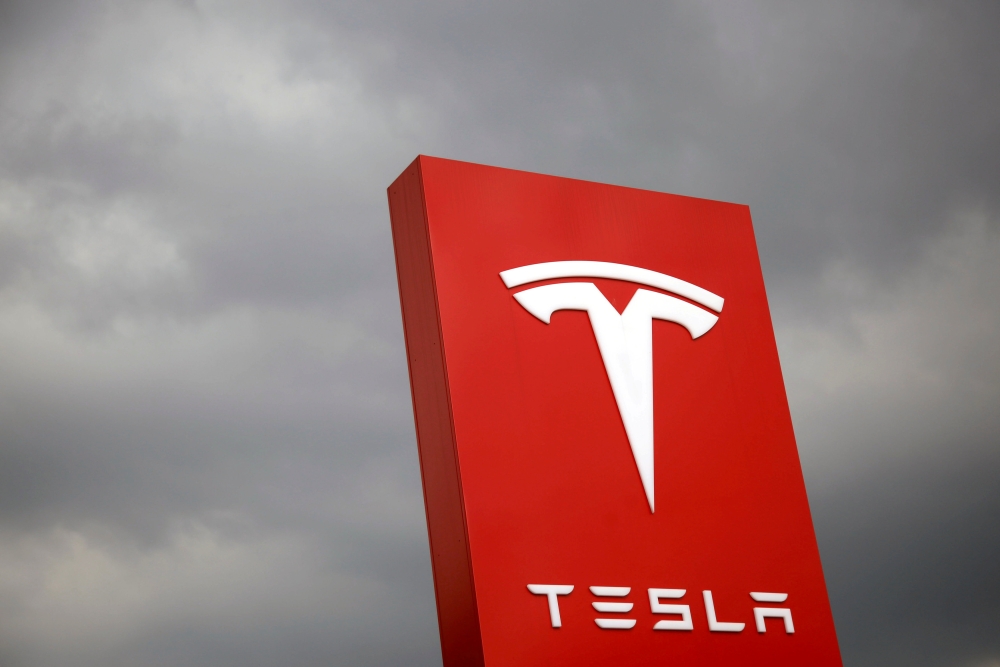 File photo of the  logo of Tesla is seen in Taipei, Taiwan. - Reuters