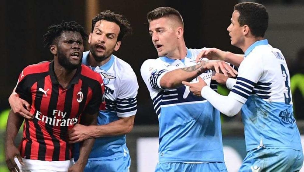 Lazio reached the Coppa Italia final beating AC Milan at a restless San Siro in the second leg of their semifinal on Wednesday.