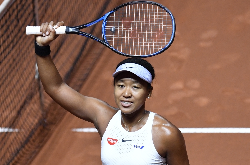 Japan's Naomi Osaka reacts after defeating Taiwan's Su-Wei Hsieh in their round-of-16 match at the WTA Tennis Grand Prix in Stuttgart, southwestern Germany, on Thursday. — AFP