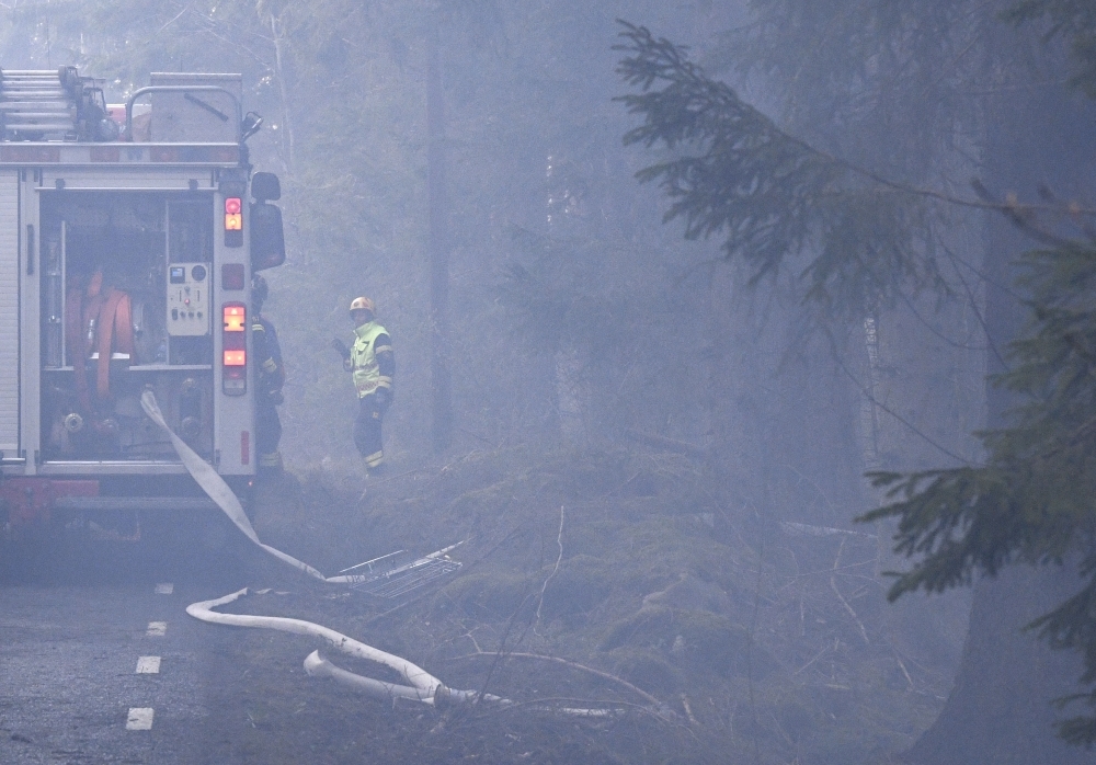 Firefighters try to put out a forest fire in the Hassleholm region in southern Sweden in this April 23, 2019 file photo. — AFP