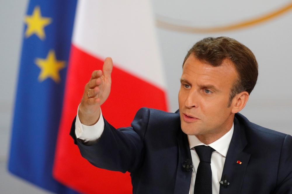 French President Emmanuel Macron speaks during a news conference to unveil his policy response to the yellow vests protest, at the Elysee Palace in Paris, France, on Thursday. — Reuters