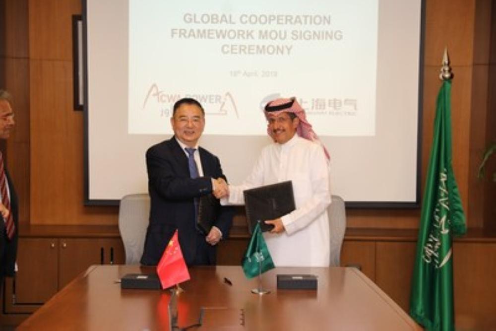 Yi Xiaorong, vice president of Shanghai Electric and Muhammed A. Abunayyan (right), chairman of ACWA Power at theMoU signing. — (PRNewsfoto)