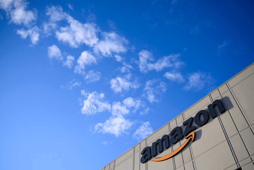 This file photo tshows the Amazon logo at the 855,000-square-foot Amazon fulfillment center in Staten Island, one of the five boroughs of New York City. — AFP