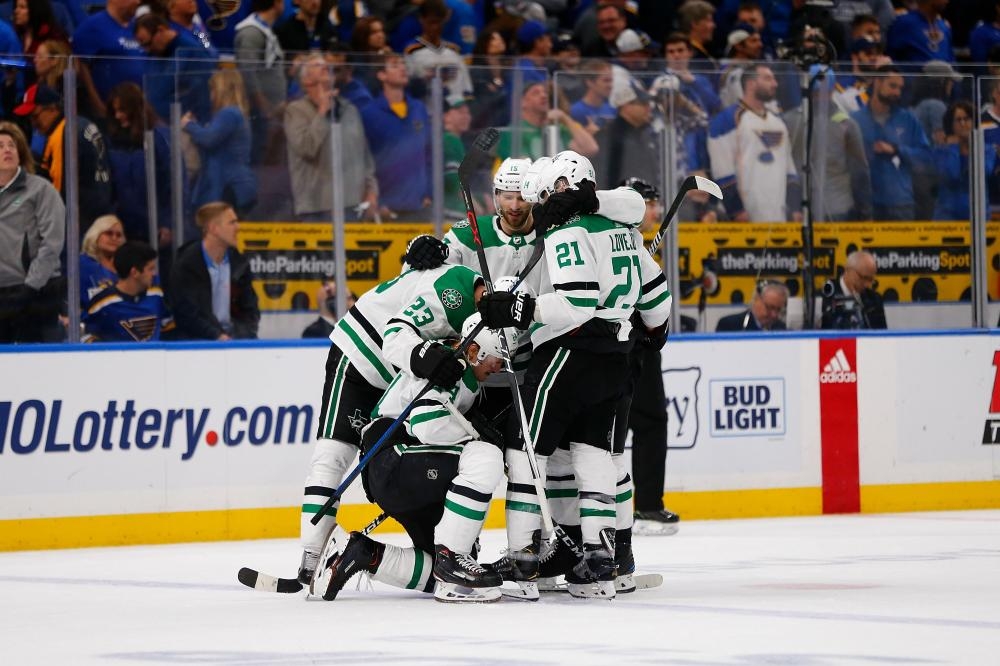 Roope Hintz of the Dallas Stars is congratulated by his teammates after scoring an empty-net goal against the St. Louis Blues in Game 2 of the Western Conference Second Stanley Cup Playoffs at the Enterprise Center in St. Louis, Missouri, Saturday. — AFP

