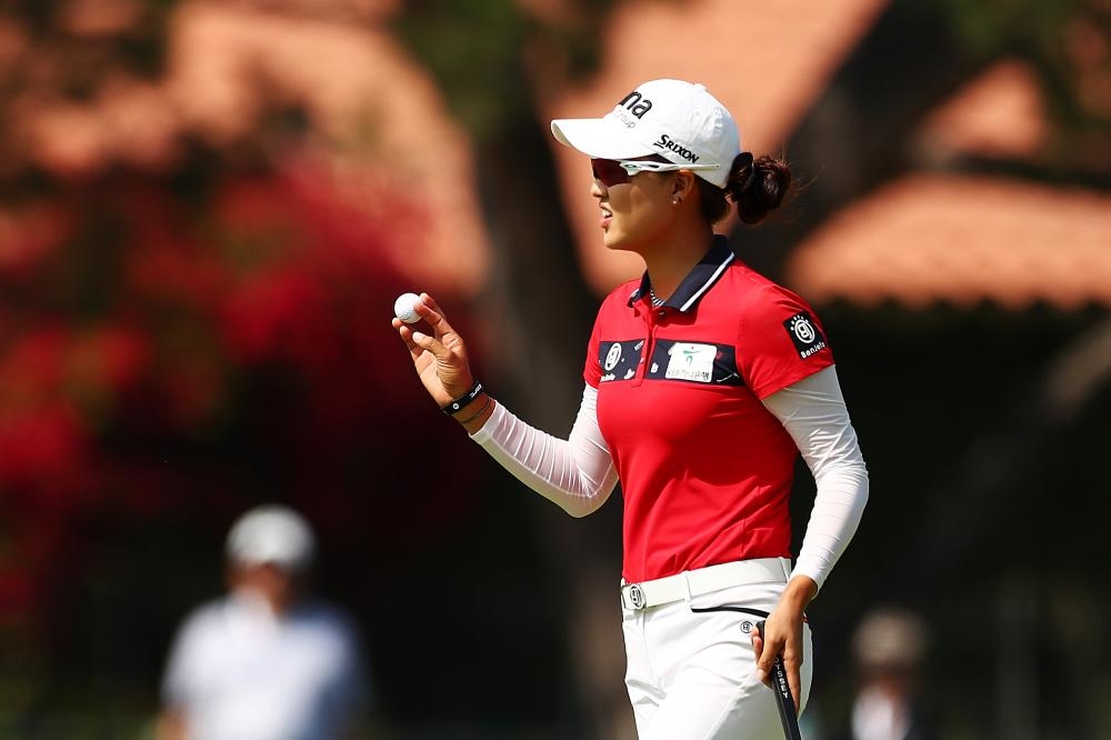 Minjee Lee of Australia reacts after her birdie putt on the fifth hole during round three of the Los Angeles Open at Wilshire Country Club in Los Angeles Saturday. — AFP