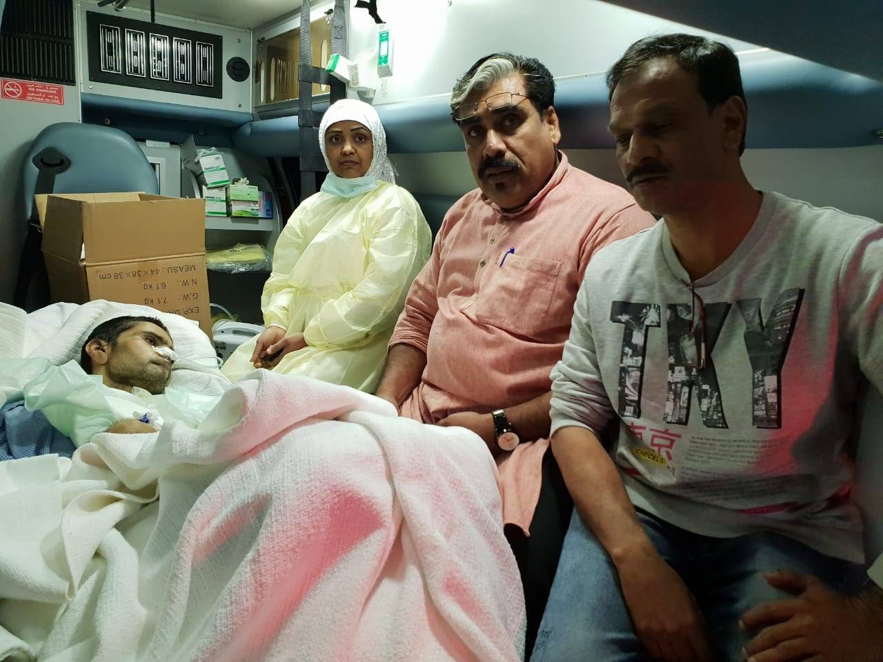 Shoukat Nass accompanies a comatose patient.