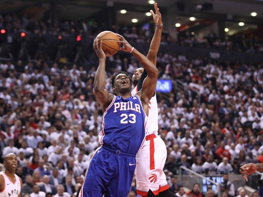 Philadelphia 76ers’ guard Jimmy Butler is fouled by Toronto Raptors guard Norman Powell during Game 2 of the second round of the 2019 NBA Playoffs at Scotiabank Arena in Toronto Monday. — Reuters 