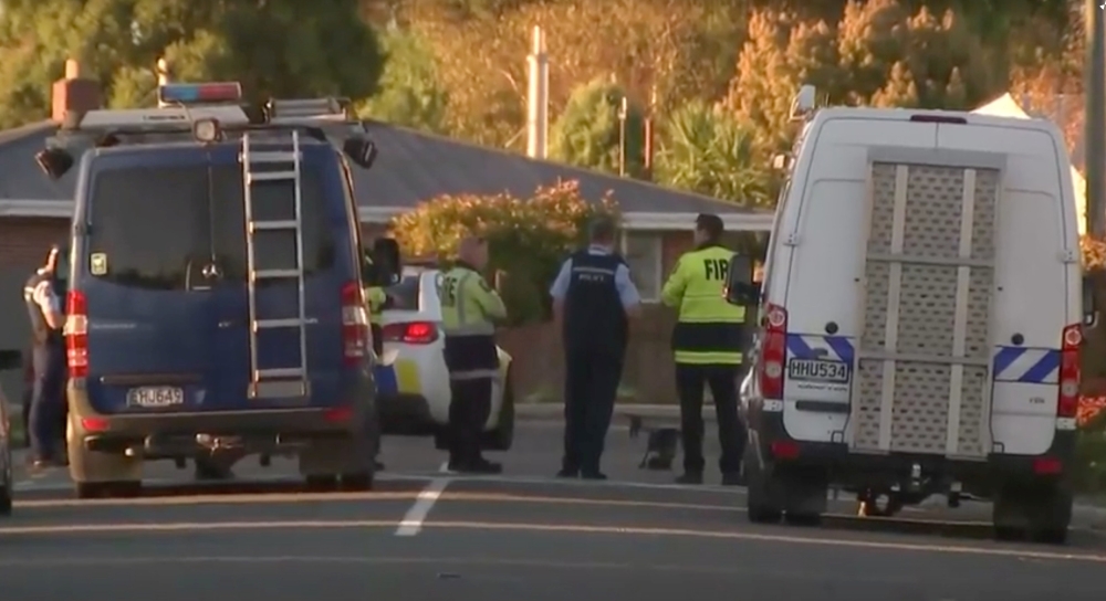 Police officers and vehicles are seen behind police cordon, in Christchurch, New Zealand in this still image taken from video on Tuesday. — Reuters