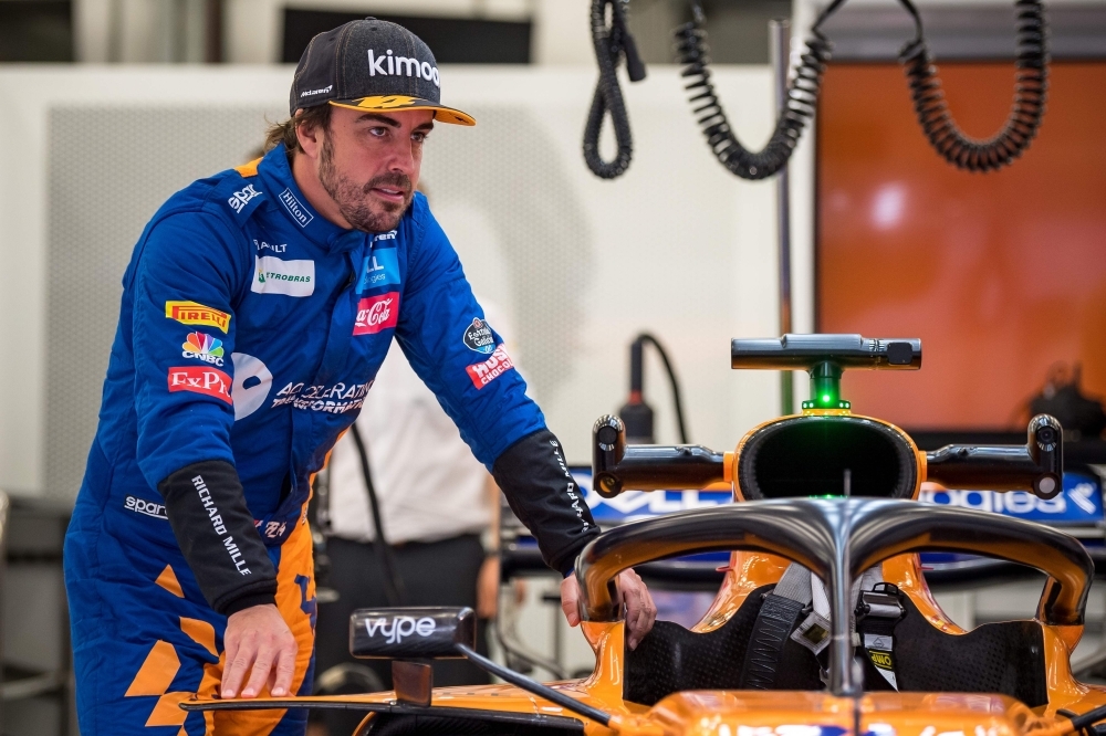 In this file photo, former F1 driver and two-time world champion Fernando Alonso leans on the car in McLaren's garage during private tests at the Sakhir circuit in the desert south of the Bahraini capital Manama, on April 2, 2019. Fernando Alonso will quit endurance racing after June's 24 Hours of Le Mans, which he won last year, the Spaniard's Toyota team said on Wednesday. — AFP