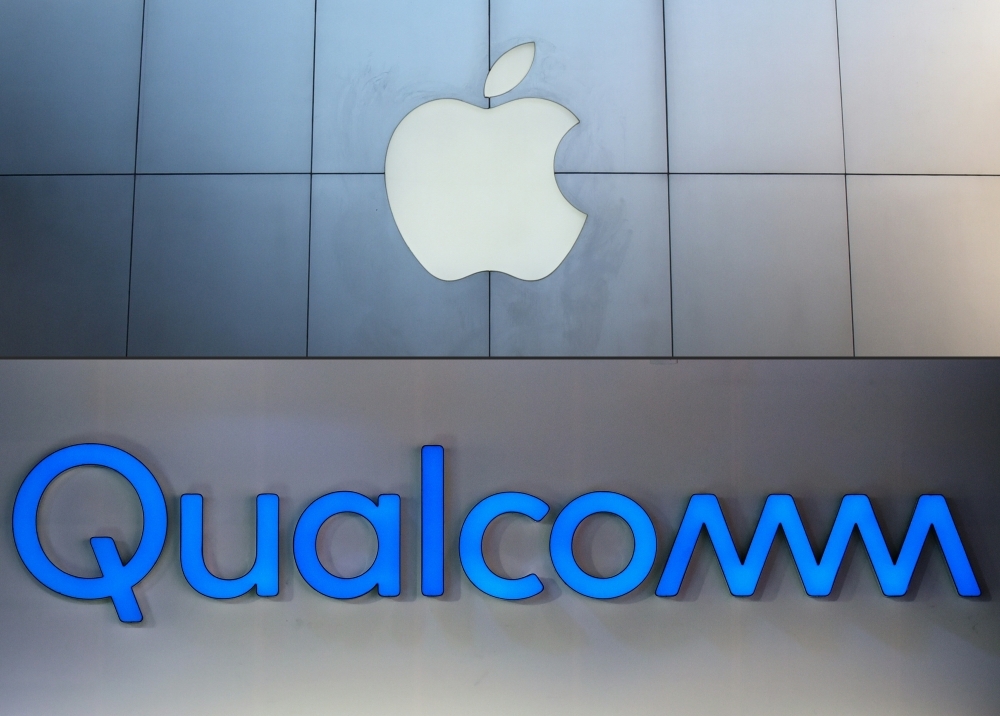 In this combination of file pictures a facade of an Apple store in Beijing (up) and a file photo of a Qualcomm logo during the Consumer Electronics Show (CES) 2018 in Las Vegas is seen. — AFP