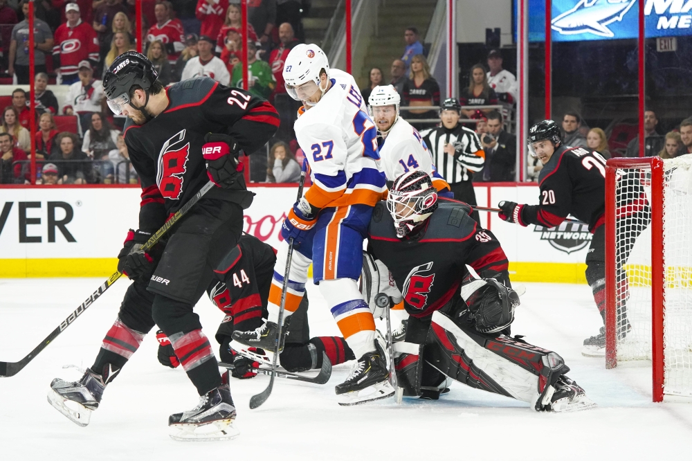 Carolina Hurricanes goaltender Curtis McElhinney (35) makes a save against New York Islanders left wing Anders Lee (27) in game three of the second round of the 2019 Stanley Cup Playoffs at PNC Arena. — Reuters