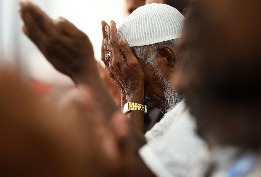 Sri Lankan Muslim men pray at the Maligawatta Jumma Mosque during Friday prayers in Colombo. — AFP