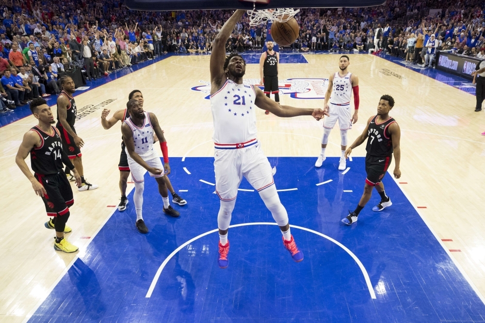 Joel Embiid No. 21 of the Philadelphia 76ers dunks the ball against the Toronto Raptors in the fourth quarter of Game Three of the Eastern Conference Semifinals at the Wells Fargo Center on Thursday in Philadelphia, Pennsylvania. The 76ers defeated the Raptors 116-95. — AFP