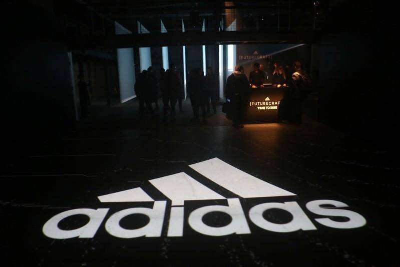 Adidas shares hit record as e-commerce boosts profits