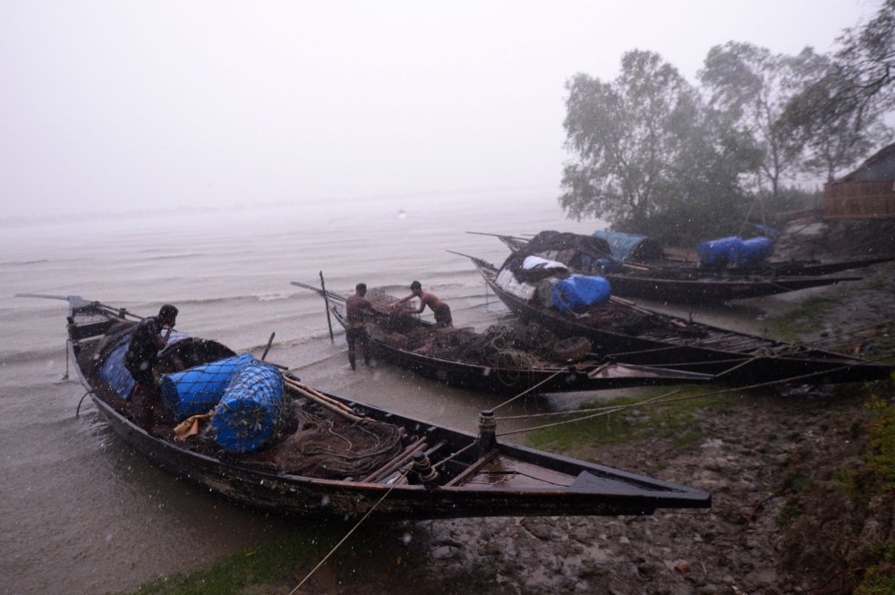 Bangladeshi fishermen moor their boats in Khulna on Friday as Cyclone Fani barrels northeastwards into West Bengal state and toward Bangladesh. — AFP 