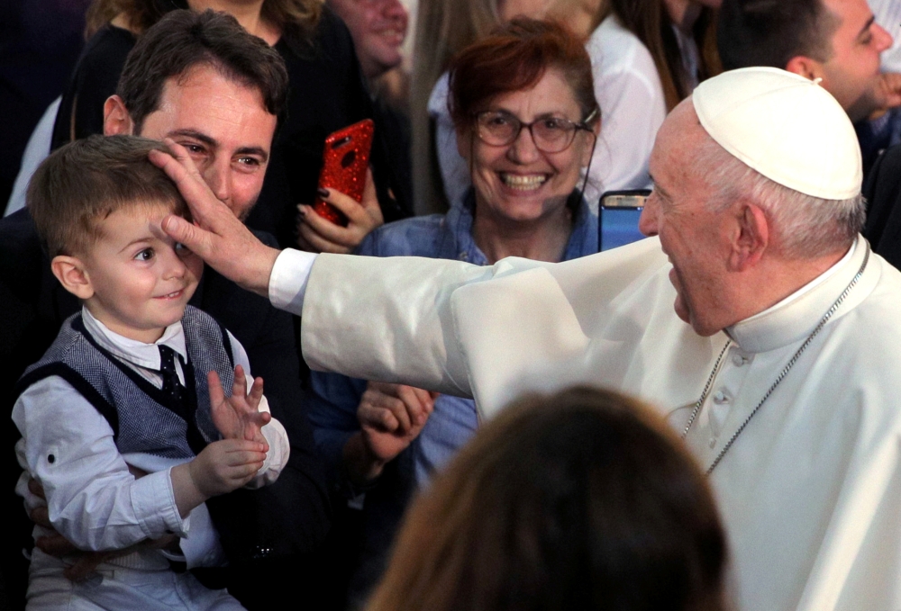 Pope Francis blesses a child during the meeting with Bulgarian Catholic community at St Michael the Archangel church in Rakovski, Bulgaria, on Monday. — Reuters