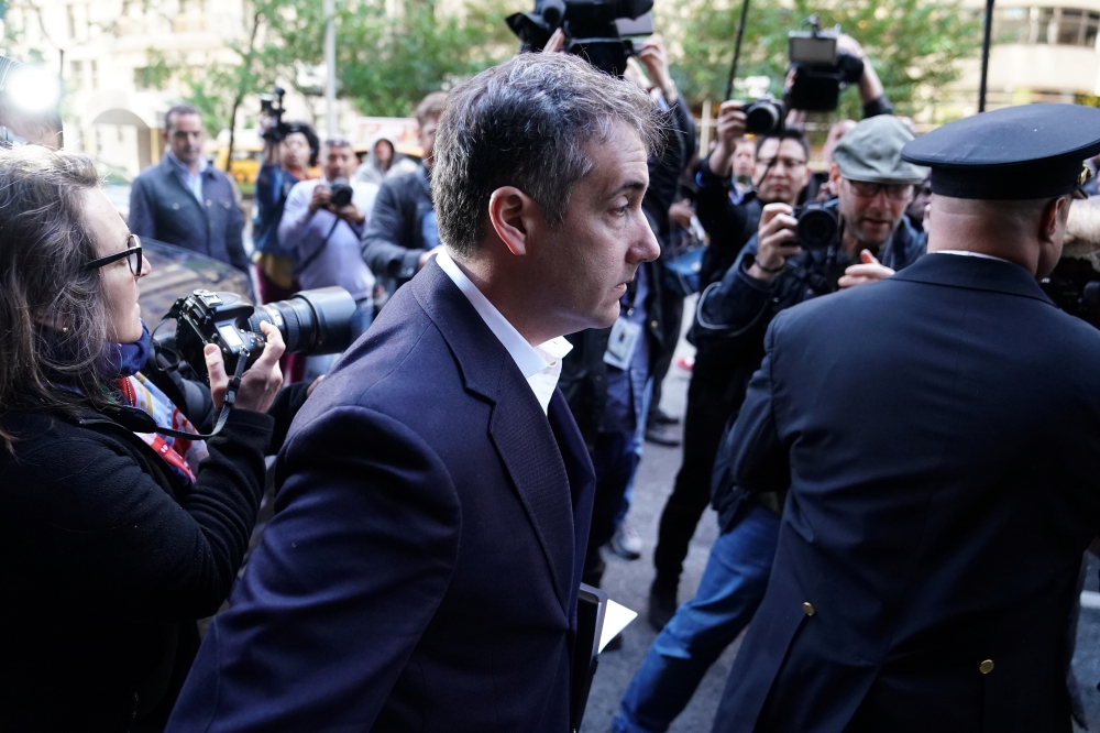 Michael Cohen, US President Donald Trump’s former lawyer, leaves his apartment building to report to federal prison in the Manhattan borough of New York, on Monday. — Reuters