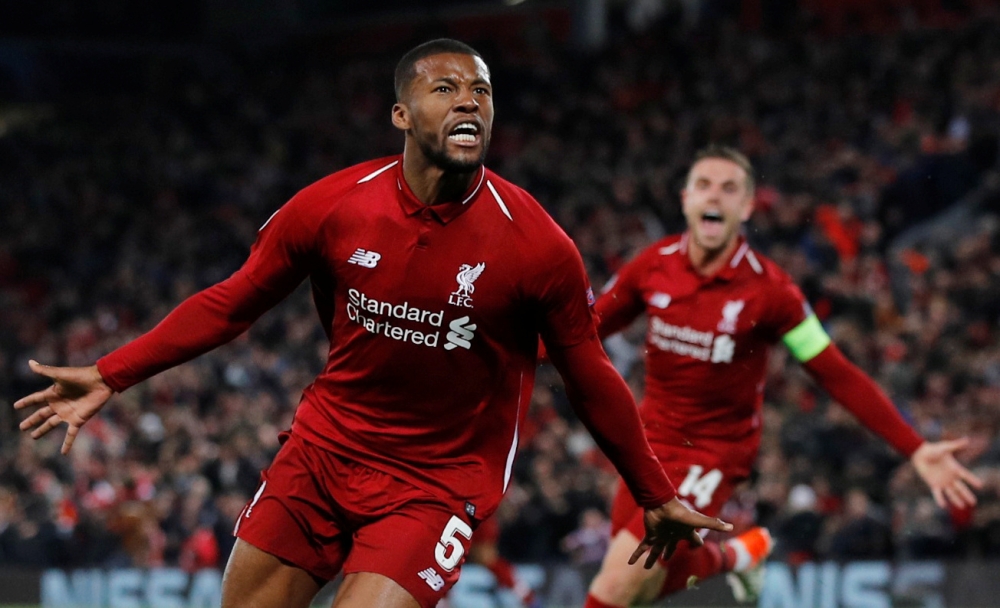 Liverpool's Georginio Wijnaldum celebrates scoring their third goal with Jordan Henderson against Bsrcelona in the Champions League semifinal second leg calsh at Anfield, Liverpool, Britain, on Tuesday. Liverpool staged a super comeback 4-3 victory to make the final. — Reuters 
