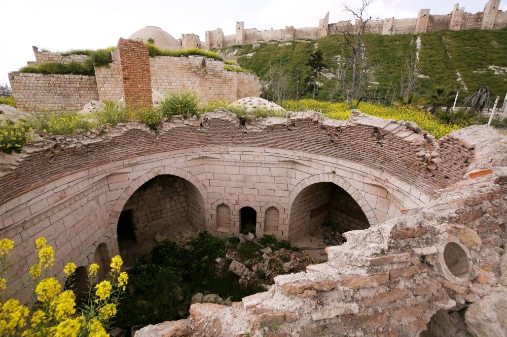 Blossomed vegetation are seen on the damaged Yalbougha bathhouse in Aleppo, Syria. Picture taken April 9, 2019. — Reuters