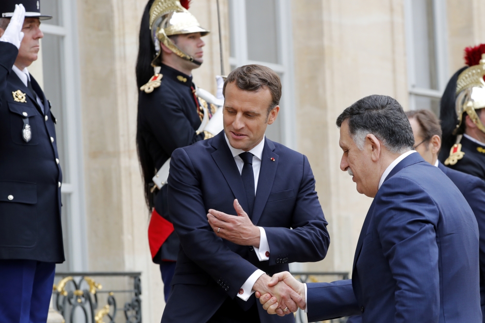 French President Emmanuel Macron meets Libyan Prime Minister Fayez Al-Sarraj, who heads the UN-backed government in Tripoli at the Elysee Palace in Paris, France, on Wednesday. — Reuters