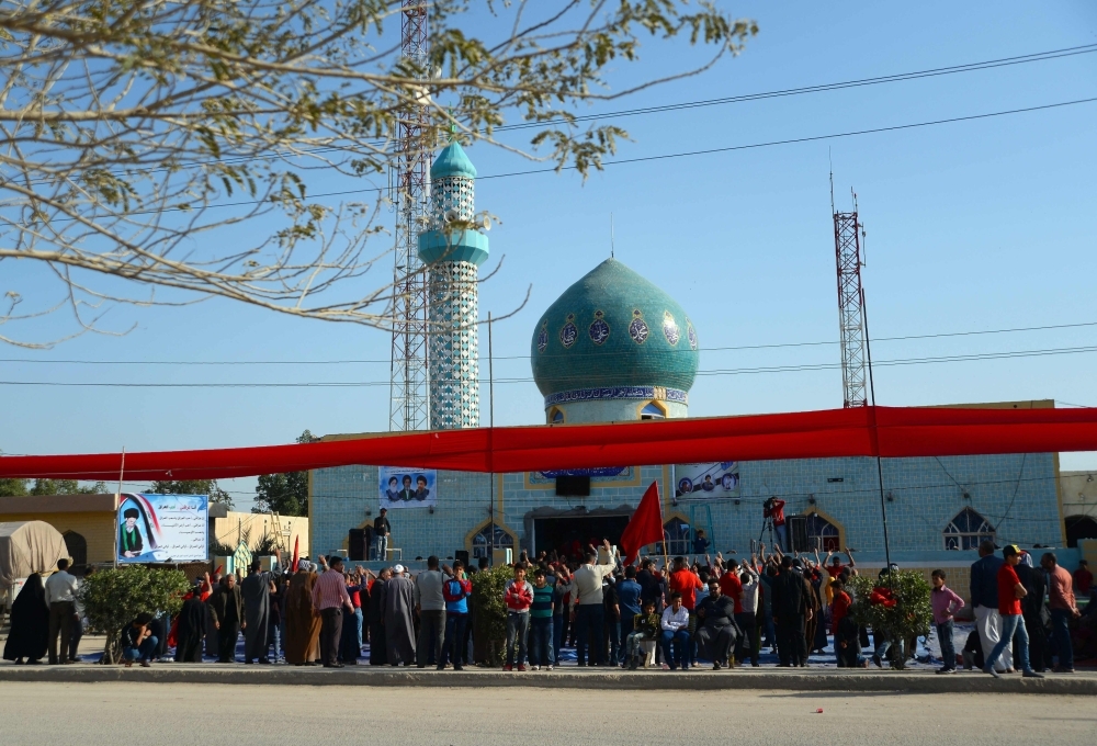 Iraqis gather in front of their local mosque during a ceremony in the town of Midhatiya, about 100 km south of the capital Baghdad, in this March 22, 2019 file photo. — AFP