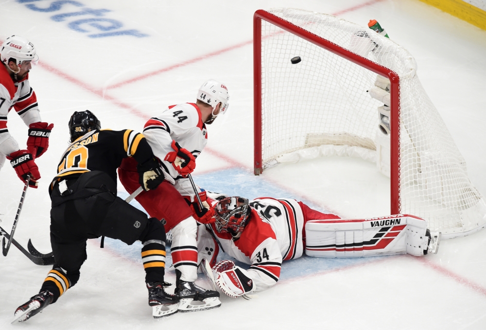 Boston Bruins left wing Marcus Johansson (90) scores a goal past Carolina Hurricanes goaltender Petr Mrazek (34) in front of defenseman Calvin de Haan (44) during the third period in game one of the Eastern Conference Final of the 2019 Stanley Cup Playoffs at TD Garden. — Reuters