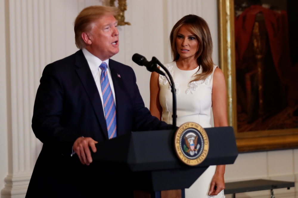 US President Donald Trump and first lady Melania Trump participate in a celebration of military mothers ahead of the Mother’s Day holiday in the East Room of the White House in Washington on Friday. — Reuters