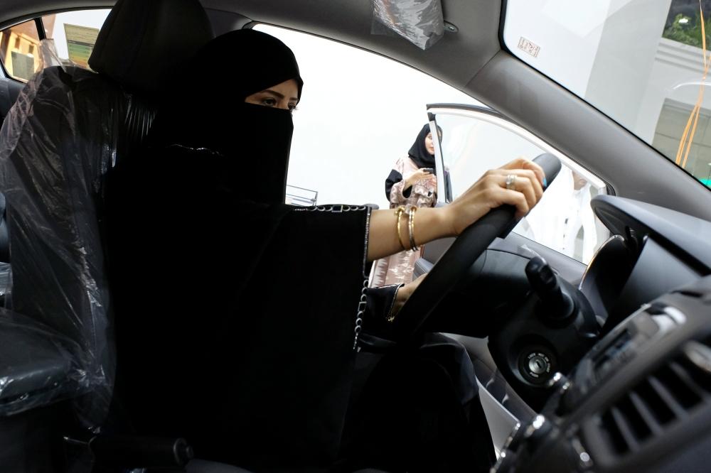 A Saudi woman checks a car at the first automotive showroom solely dedicated for women in Jeddah on Jan. 11, 2018. — File photo