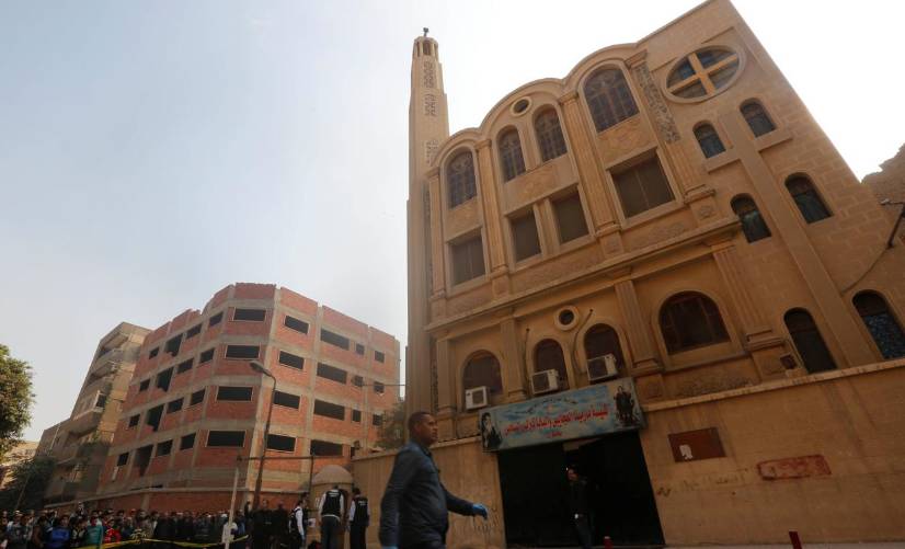 Policemen inspect the site of attack on Mar Mina church in Helwan district on the outskirts of Cairo, on December 29, 2017. — Reuters