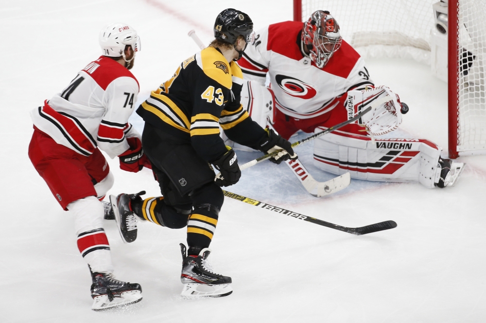 Boston Bruins center Danton Heinen (43) scores a goal on Carolina Hurricanes goaltender Petr Mrazek (34) during the third period in game two of the Eastern Conference Final of the 2019 Stanley Cup Playoffs at TD Garden. — Reuters