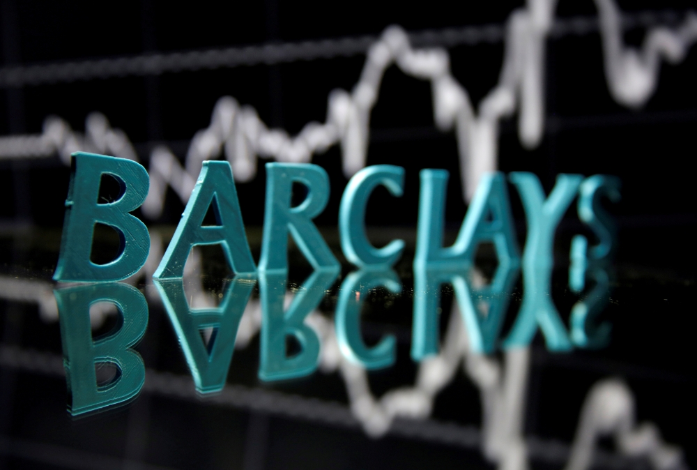 The Barclays logo is seen in front of displayed stock graph in this illustration. — Reuters