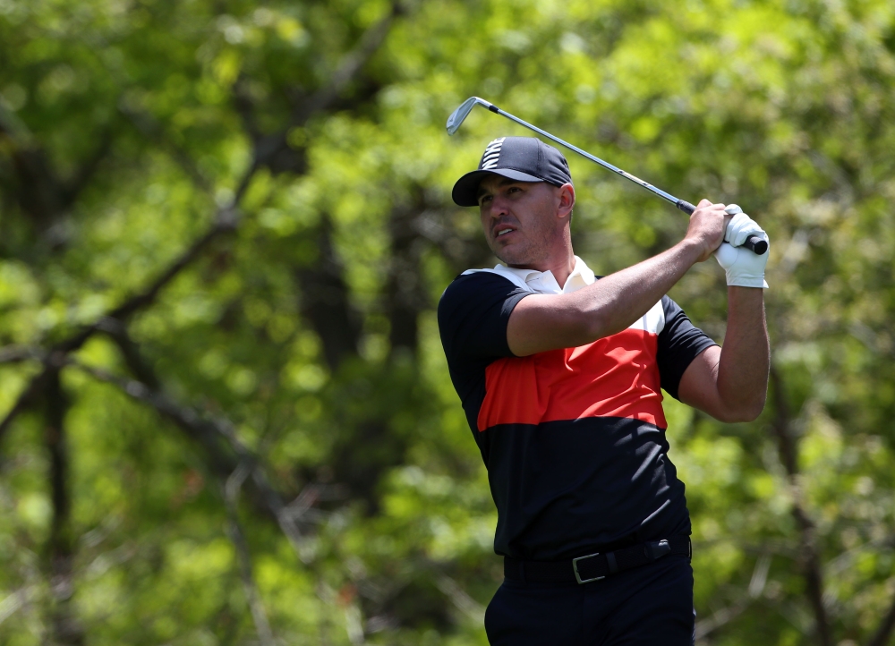 Brooks Koepka plays his shot from the eighth tee during the first round of the PGA Championship golf tournament at Bethpage State Park - Black Course. — Reuters