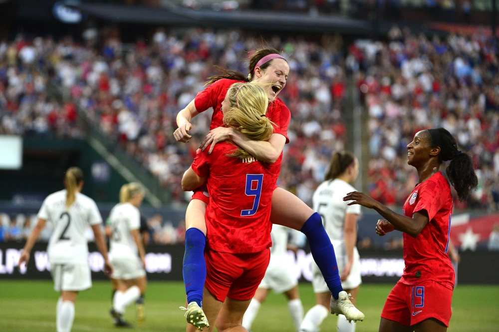 May 16, 2019; St. Louis , MO, USA; USA midfielder Rose Lavelle (16) celebrates with midfielder Lindsey Horan (9) and defender Cyrstal Dunn (19) after scoring against New Zealand goalkeeper Erin Nayler (not pictured) in the first half during a Countdown to the Cup Women's Soccer match at Busch Stadium. Mandatory Credit: Jeff Curry-USA TODAY Sports