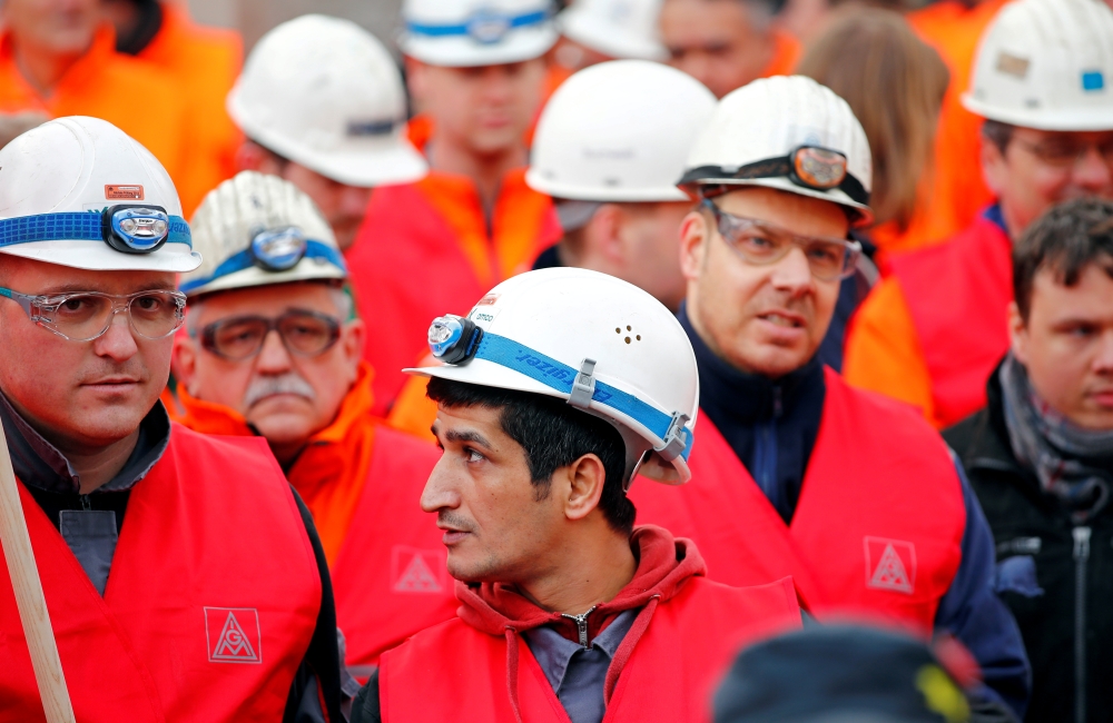 Workers of German steel maker ThyssenKrupp AG protest in a warning strike organized by German union IG Metall for higher wages at the ThyssenKrupp steel Europe plant of Dortmund, Germany, in this file photo. — Reuters