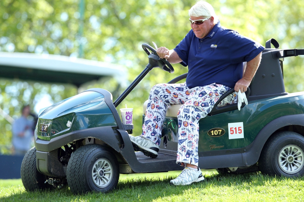 John Daly gets out of his cart on the third green during the first round of the PGA Championship golf tournament at Bethpage State Park - Black Course. — Reuters