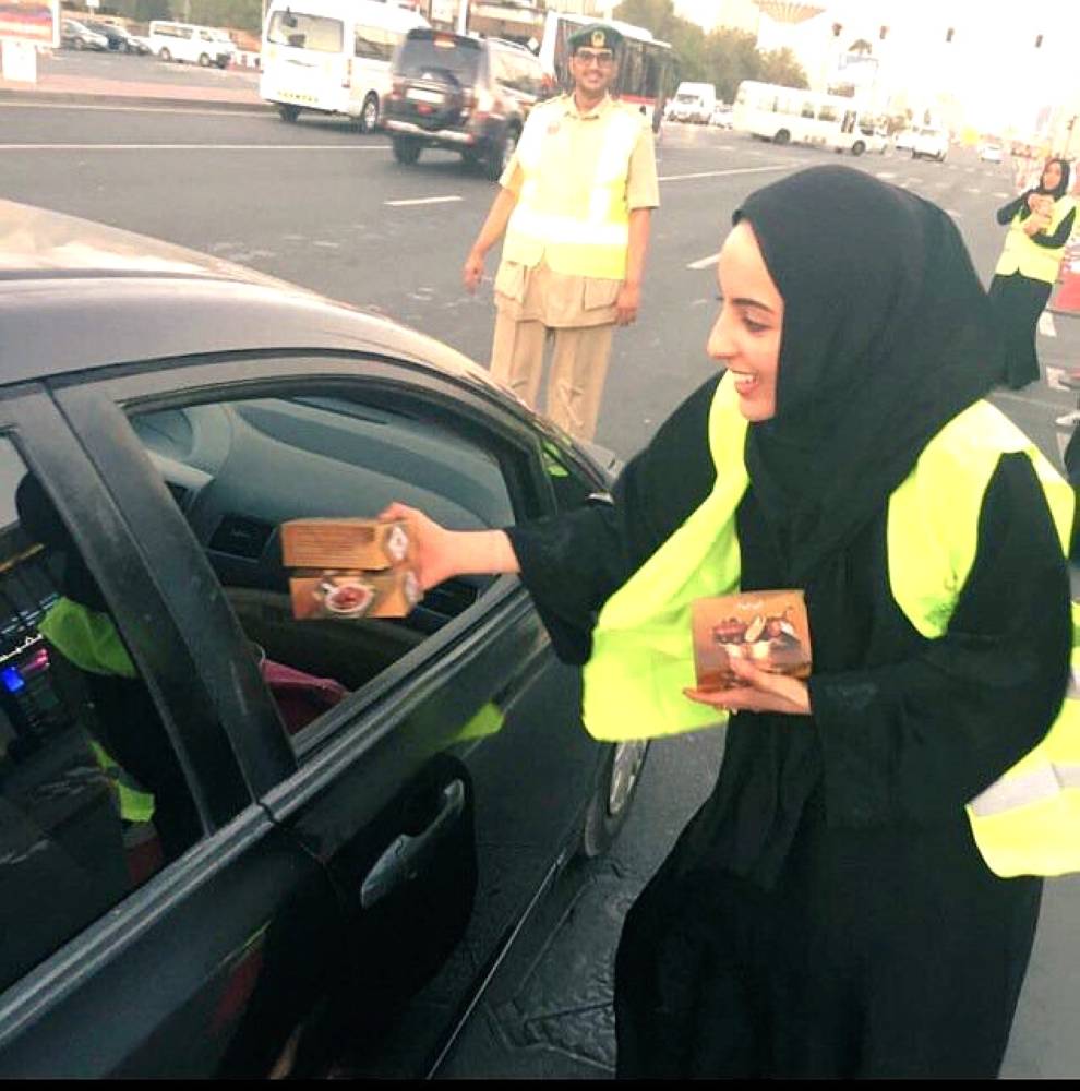 UAE’s Minister of State for Youth Affairs Shamma Al-Mazrui distributing iftar meals to motorists.