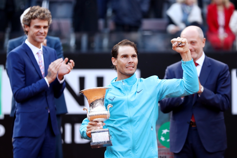 Spain's Rafael Nadal poses as he celebrates winning the Italian Open final against Serbia's Novak Djokovic with the trophy in Rome on Sunday. — Reuters