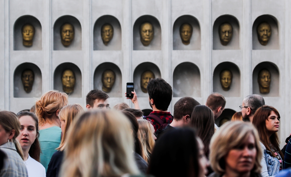 People gather before the screening of final episode of Game of Thrones on 20-meter-high screen at RZD Arena in Moscow. — Reuters