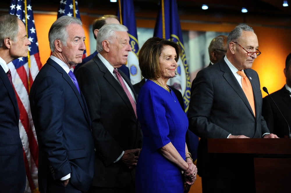 US Senate Democratic Leader Chuck Schumer (D-NY) (R), House Speaker Nancy Pelosi (D-CA), and other Democratic lawmakers speak to Capitol Hill reporters after a planned White House meeting with US President Donald Trump to discuss infrastructure was cut short in Washington, US,on Wednesday.— Reuters