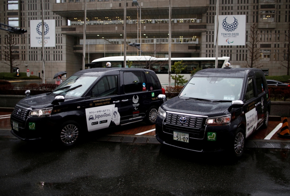 Toyota Motor Corp.'s JPN Taxi cars are parked in Tokyo, Japan, in this file photo. — Reuters