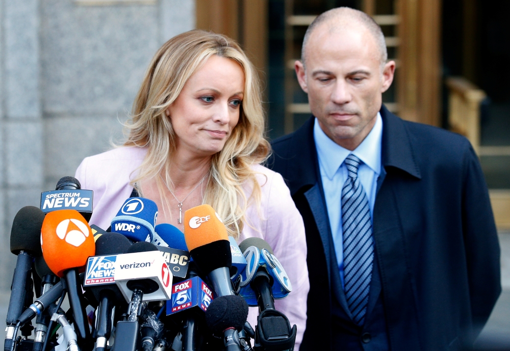 Stormy Daniels, whose real name is Stephanie Clifford, speaks to media along with lawyer Michael Avenatti (R) outside federal court in the Manhattan borough of New York City, New York, US, in this file photo. — Reuters